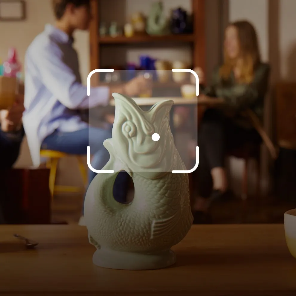 Image of green fish vase with Google Lens framing around it