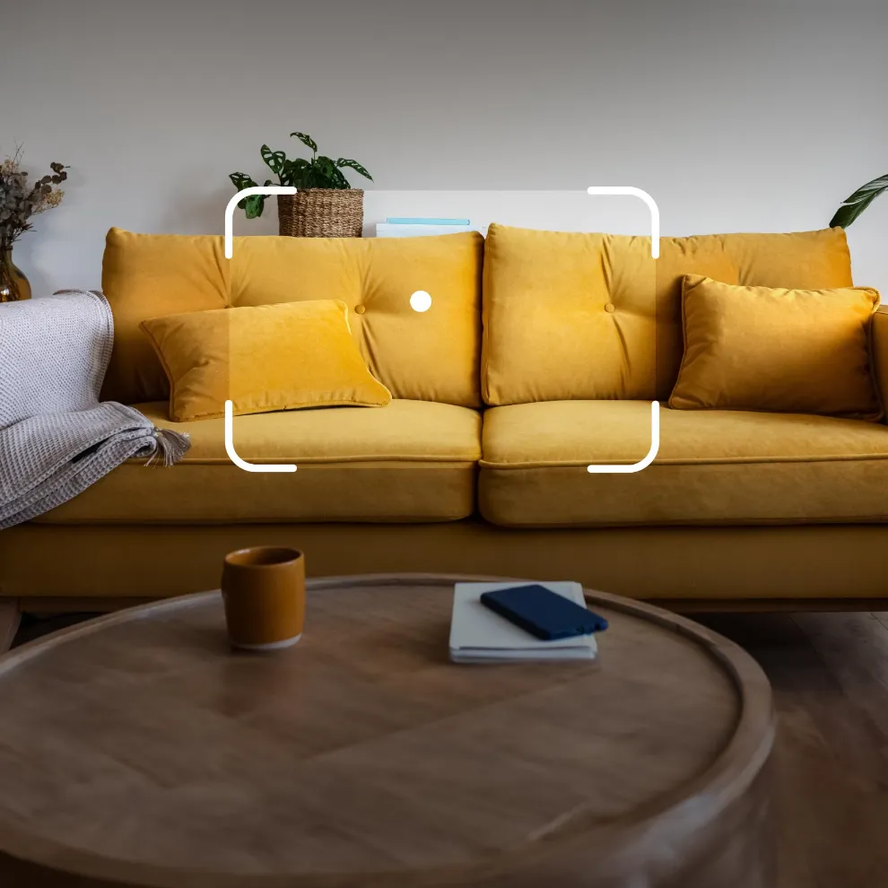 Image of yellow couch with Google Lens framing around it